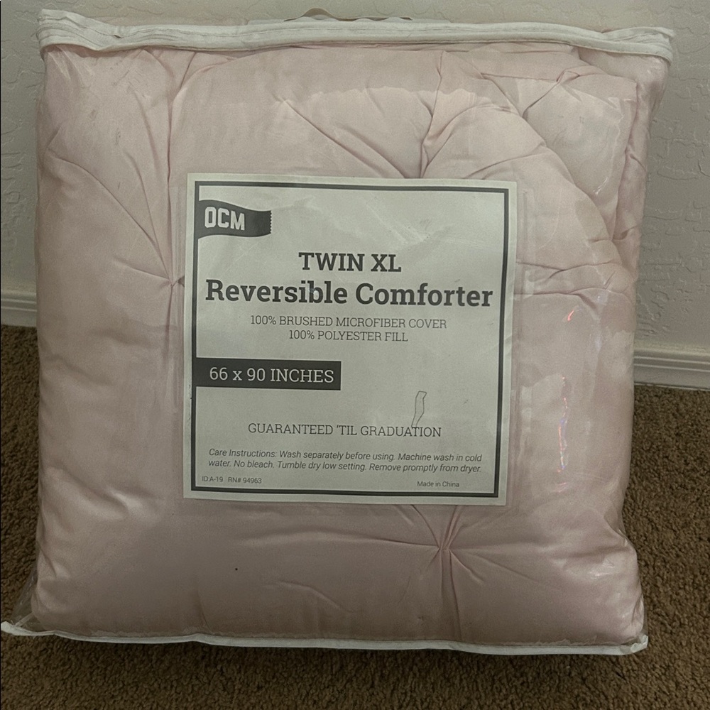 New in plastic! Twin XL comforter.